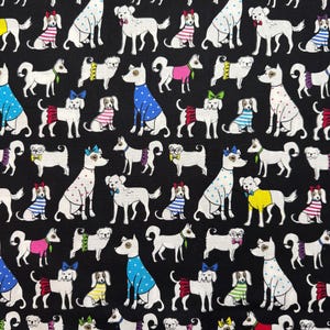 May include: A black fabric with a repeating pattern of white dogs wearing colorful outfits. The dogs are in various poses, including sitting, standing, and running. Some dogs are wearing hats, bow ties, and other accessories.