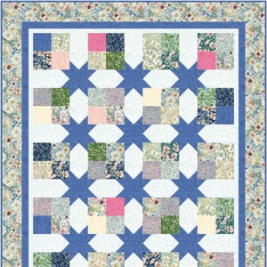 May include: A quilt with a blue and white star pattern. The quilt is made up of smaller squares of fabric with floral patterns in shades of pink, green, and blue.