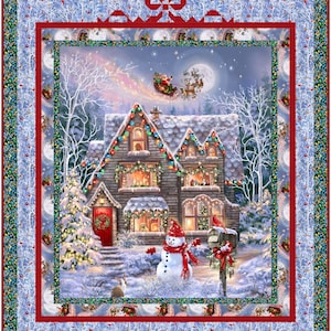 May include: A Christmas-themed quilt featuring a snowy scene with a decorated house, snowman, and Santa's sleigh. The house has lit windows and a red door. The quilt has a red border and a blue and white patterned background.