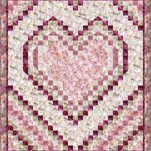 May include: A pink and white quilt with a heart-shaped design in the centre. The heart is made up of smaller squares of fabric in various shades of pink and white. The quilt is bordered by a dark red fabric.