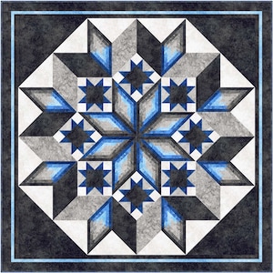 May include: A geometric quilt block with a starburst design in shades of blue, gray, and white. The block is made up of multiple layers of fabric, creating a three-dimensional effect.