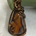 Bridgett Stanley reviewed Antique brass wire wrapped tiger eye pendant