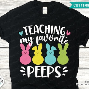 May include: Black t-shirt with white text that reads "TEACHING my favorite PEEPS" with a heart on either side of the text. Four yellow, pink, blue, and green cartoon peeps are below the text.