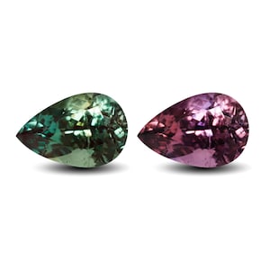 May include: Two pear-shaped faceted gemstones displayed side by side. The left gemstone exhibits a vibrant green hue with subtle yellow undertones. The right gemstone displays a deep purple and magenta color profile with distinct light reflections.