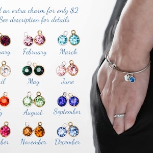 You can also add an additional charm to the bracelet. This photo features a gemstone for $2 more per bracelet. You can choose from January, February, March, April, May, June, July, August, September, October, November December gemstone colors.