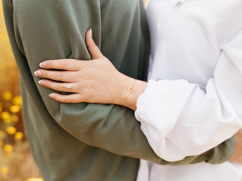 This photo features the bride wearing it. Not only is the bracelet perfect for Bridesmaids, Maid of Honors, Junior Bridesmaids, Matron of Honors, Flower girls, but it's also perfect for the bride so she can match with her bridal party.