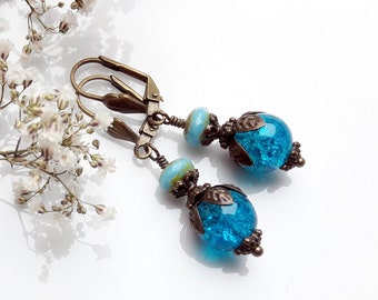 Blue and turquoise colored sleeper earrings, made of glass beads