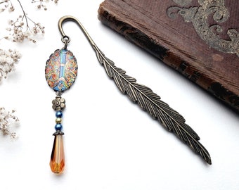 Medieval bookmark in yellow and bronze colors, with illuminated cabochon and metal feather
