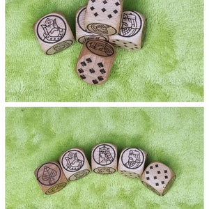 May include: A set of wooden dice with various symbols and designs, including a spade, a king, and a queen. The dice are brown and have black markings.