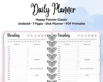 May include: A pink and white daily planner with a black and white design. The planner is undated and has a disk binding system. The planner has a section for scheduling, things to do, notes, and a mood tracker. The planner is labeled "Daily Planner" and "Happy Planner Classic".