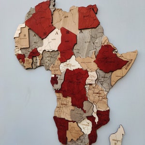 Wooden Africa Wall Map. Elevate your decor with artisan-crafted charm. Ideal for travel lovers, adding rustic allure to your space.