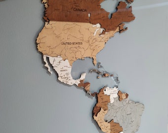 Explore the Americas with our stunning wooden wall map. Handcrafted, vintage, and detailed. Perfect for home decor and travel enthusiasts.