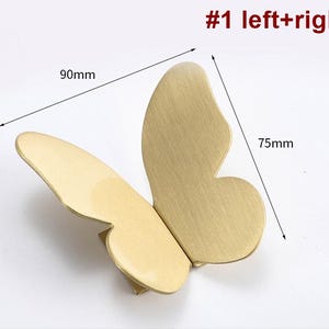 May include: A pair of gold butterfly-shaped cabinet door pulls, each measuring 75mm wide and 90mm tall. #1 left+right