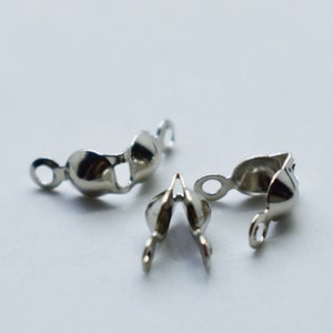 May include: Three silver metal clasps for jewellery making. The clasps are designed to be used for necklaces, bracelets, or other jewellery projects.