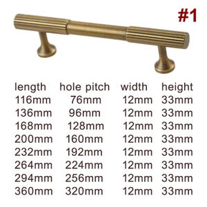 May include: A brushed brass cabinet pull with a rectangular shape and a grooved design. The pull is available in various lengths, from 116mm to 360mm, with a hole pitch ranging from 76mm to 320mm. The pull is 12mm wide and 33mm high.