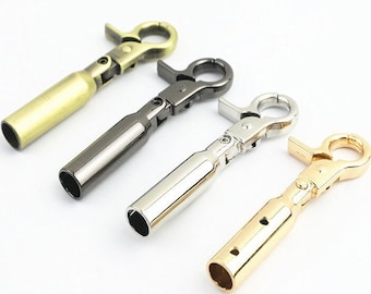 May include: Four metal swivel clasps in different finishes: gold, silver, black, and brass. Each clasp has a spring-loaded hook and a swiveling loop.