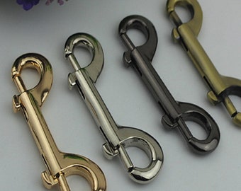 May include: Four metal swivel snap hooks in gold, silver, and black.