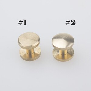 May include: Two brass screw-on studs, one with a flat top and one with a domed top. #1 and #2 are labelled on the image.