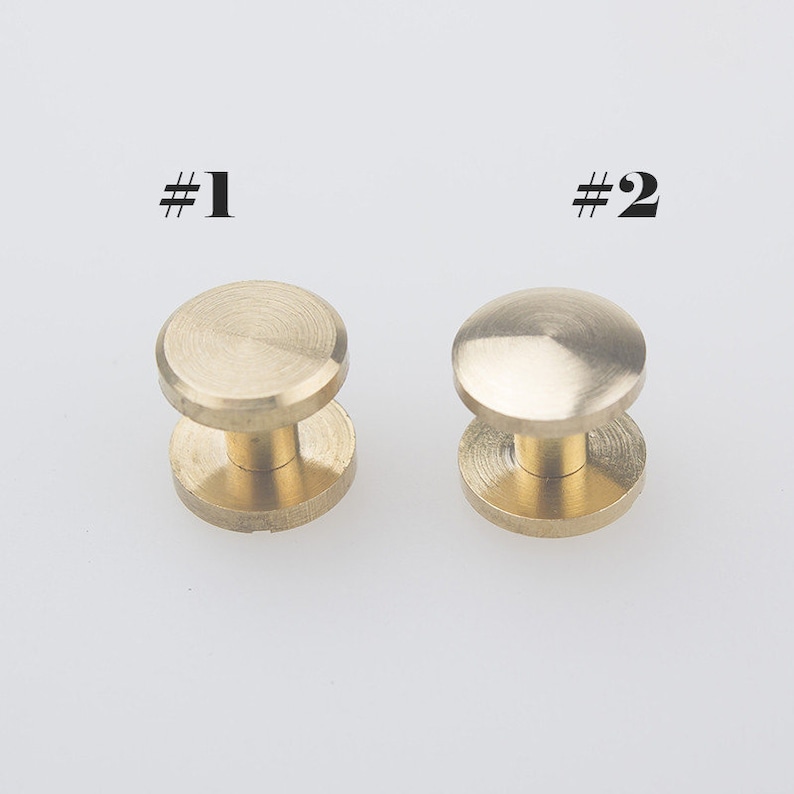 May include: Two brass screw-on studs, one with a flat top and one with a domed top. #1 and #2 are labelled on the image.