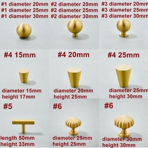 May include: Assortment of gold-toned cabinet knobs and pulls in various styles and sizes.  The knobs are round, cone-shaped, and have a fluted design. The pulls are a simple T-shape and a round knob with a fluted design.  The measurements are in millimeters.