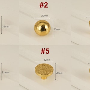 May include: A collection of six gold-colored cabinet knobs with textured surfaces. Measurements are provided in millimeters. Knob styles include spherical, cylindrical, and faceted designs, ranging from 20mm to 32mm in diameter and up to 31mm in height.