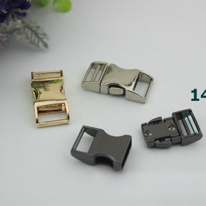 May include: Three metal clasps for straps or belts. The clasps are 14 mm wide and come in gold, silver, and black.