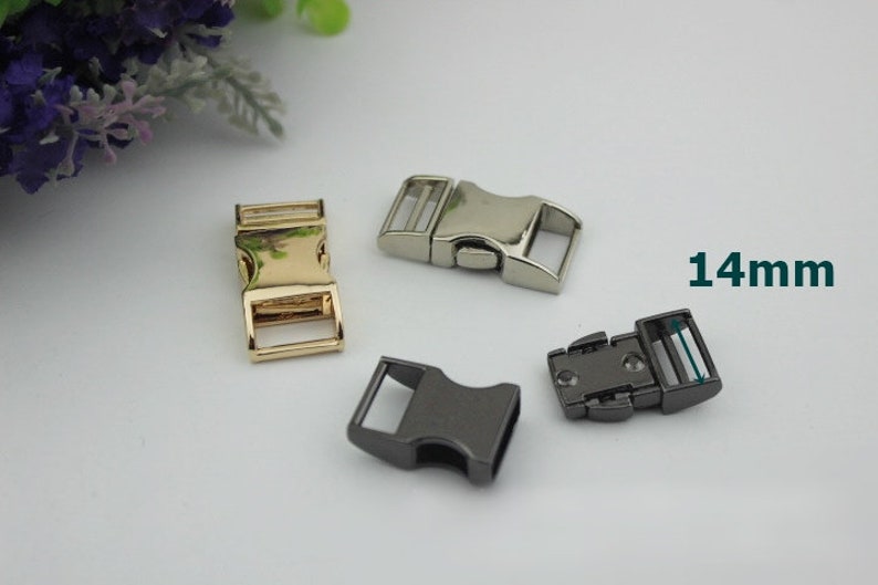 May include: Three metal clasps for straps or belts. The clasps are 14 mm wide and come in gold, silver, and black.