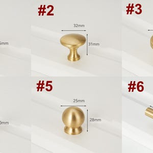 May include: Ten different styles of gold cabinet knobs and pulls. The knobs are round, square, and cylindrical. The pulls are a simple bar shape. The knobs and pulls are all made of brass and have a polished finish.