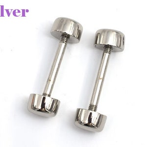 May include: Two silver-colored barbell earrings with a screw-on design. The earrings have a cylindrical post with a rounded cap on each end. The word "Silver" is displayed in a purple font.