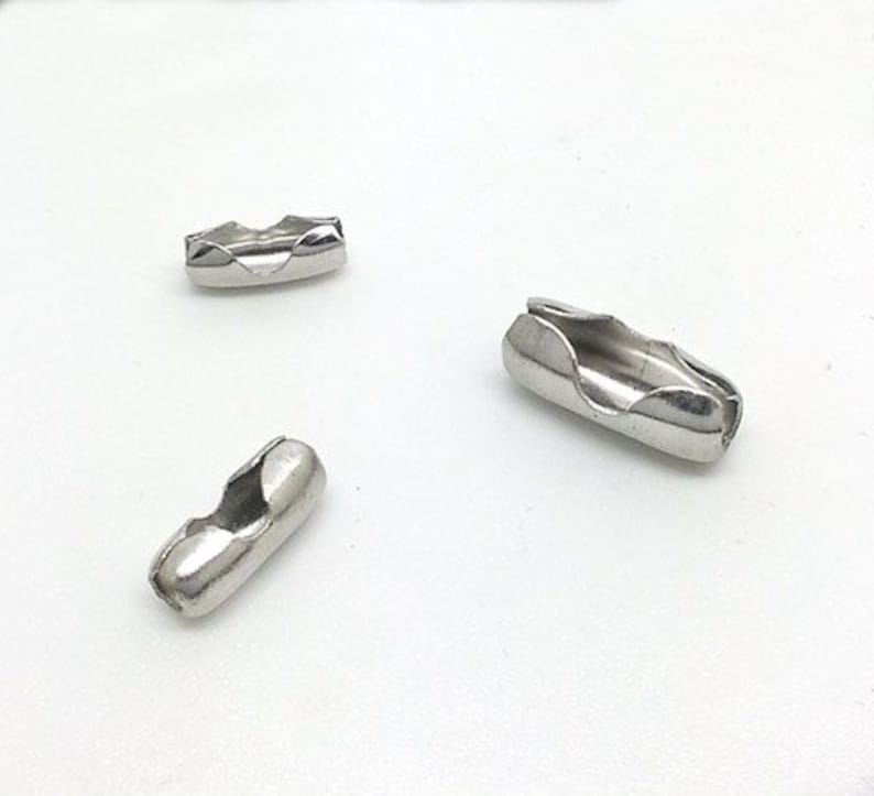 May include: Three silver metal chain connectors. The connectors are designed to be used with chain necklaces or bracelets.