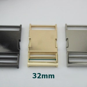 May include: Three metal slider buckles in black, gold, and silver. Each buckle measures 32mm in length.