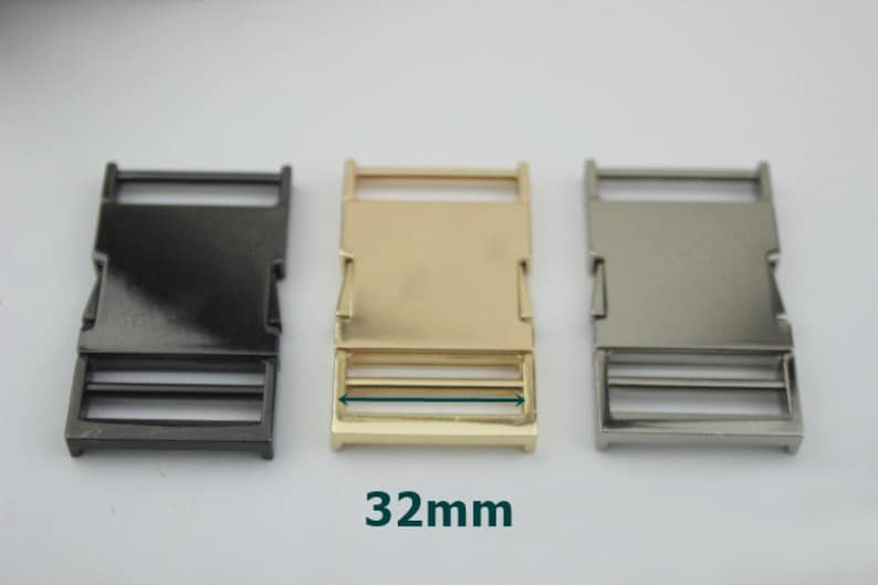 May include: Three metal slider buckles in black, gold, and silver. Each buckle measures 32mm in length.