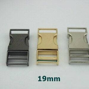 May include: Three plastic buckle closures in black, gold, and silver. Each buckle measures 19 mm in width.
