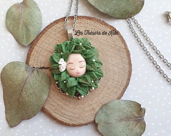 Fancy pendant. Face and leaves pendant. Small sleeping face pendant in the foliage. Original pendant