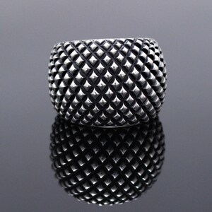 Padded domed ring