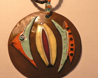 Enamel fish on Brown Pearl