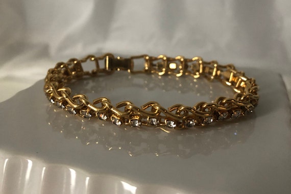 Gold Tone Tennis Bracelet, Clear Rhinestones, Fol… - image 1