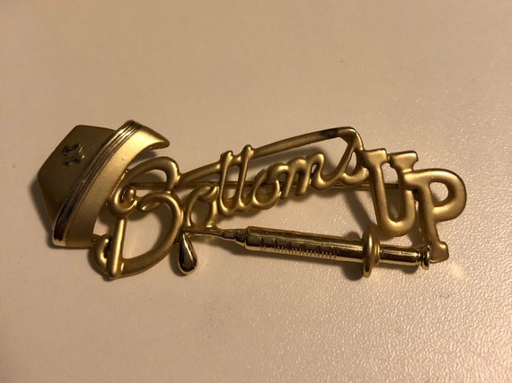 Vintage Gold Tone Bow Brooch Bali Graduate Corsetiere Badge Pinback