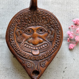 old terracotta oil lamp