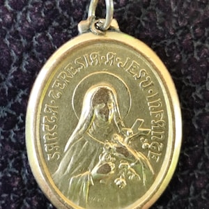Old golden oval Saint Therese medal