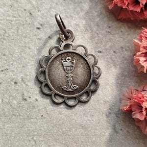 silver holy  communion medal