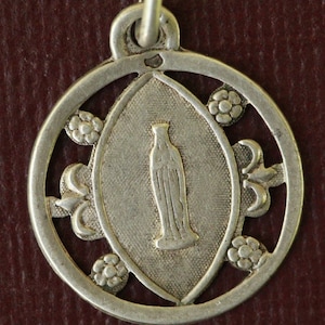 Silver lourdes medal