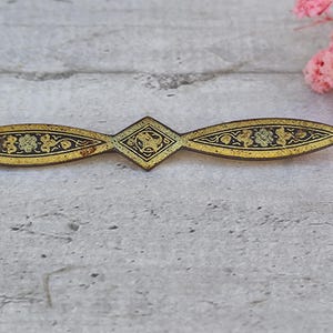 damascene brooch