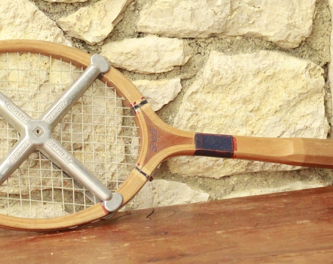 rare wooden tennis racket with zephyr press.