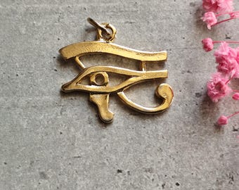 Pendentif égyptien oeil d&#39;horus de couleur or symbole de protection