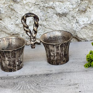 Antique metal salt and pepper shakers