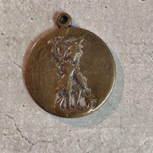 Antique religious medal of Saint Michael and Mont Saint Michel in brass