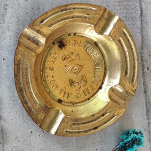 Old cigarette paper ashtray job