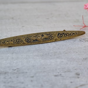 damascene brooch