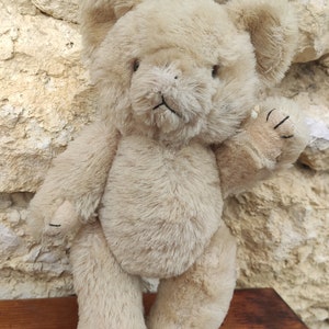 old straw bear stuffed toy